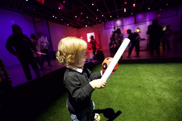 Child with Light Sword at Baby Rave Event