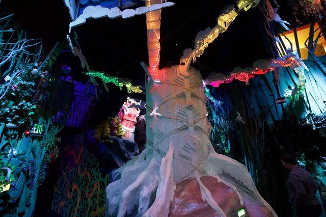 Illuminated Fantasy Sculpture with Colorful Dragon Canopy