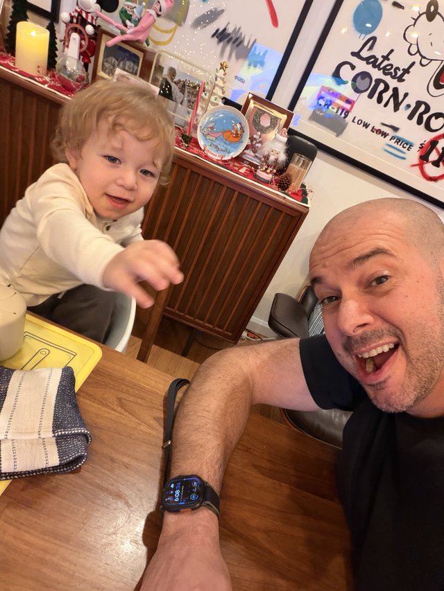 Father and Toddler Selfie at Festive Kitchen Table