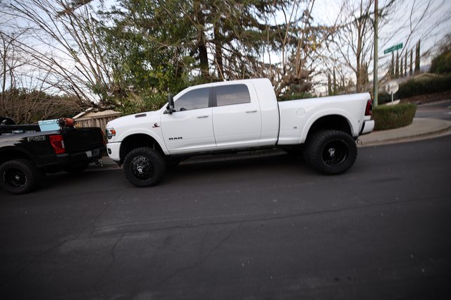 Lifted White Ram Truck on Suburban Street