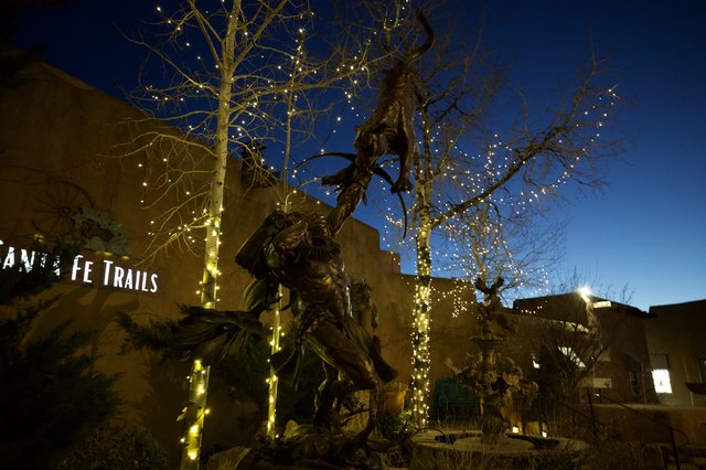 Illuminated Bronze Statue at Twilight in Santa Fe