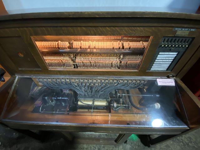 Old-fashioned piano with keyboard and light