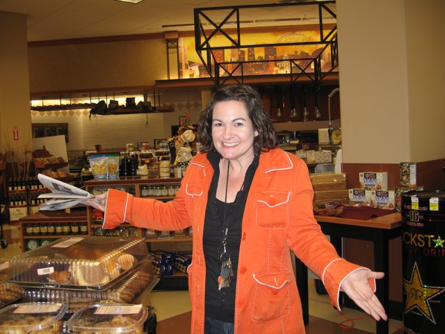 Orange Coated Woman in the Deli Section