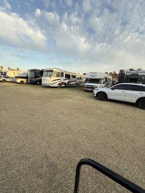 Gathering of Motor Homes Under a Cloudy Sky