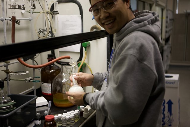 Laboratory Man with Liquid Bottle