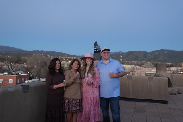 Rooftop Family Portrait with Majestic Mountain Range