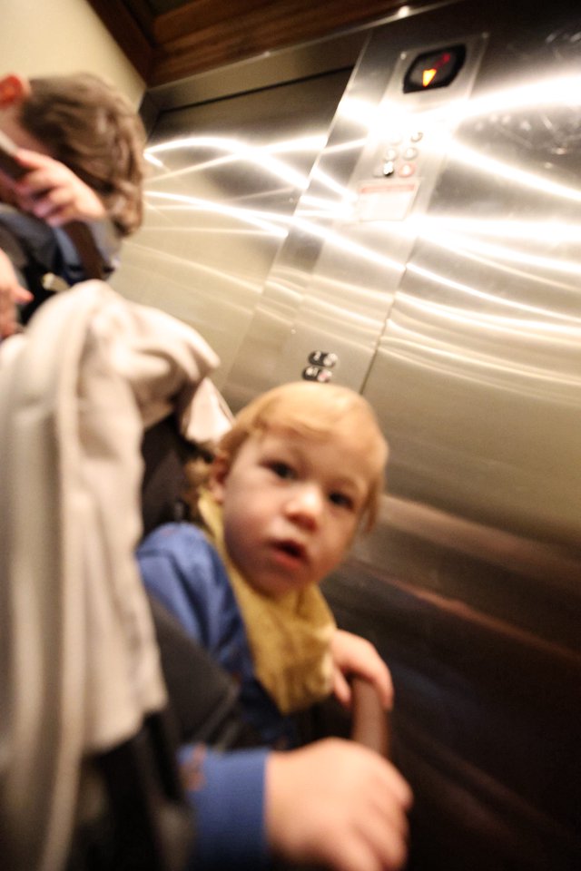Child in Elevator with Parent - Candid Moment