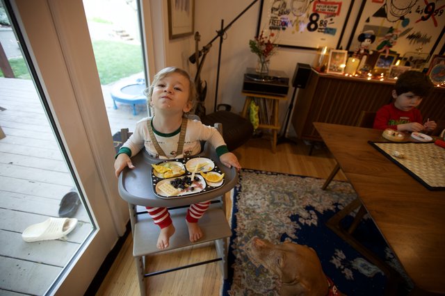 Toddler Proudly Carrying Christmas Eve Dinner Tray