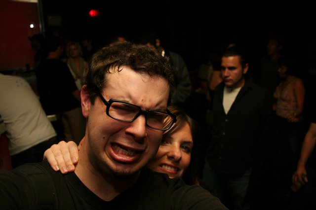 Friends Making Funny Faces at a Nightclub Party