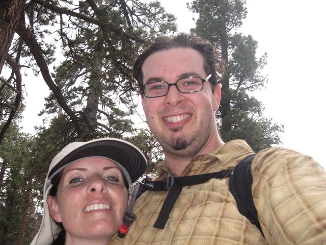 Hikers Selfie Among Pine Trees on Mountain Trail