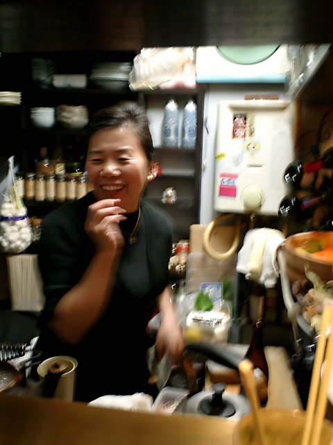 Smiling portrait in a cozy Tokyo restaurant