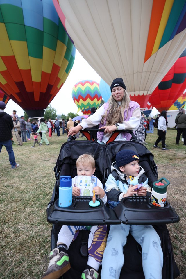 Family Watches Hot Air Balloons at Classic Festival