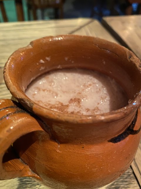 Deliciously Warm Brown Pot of Hot Chocolate