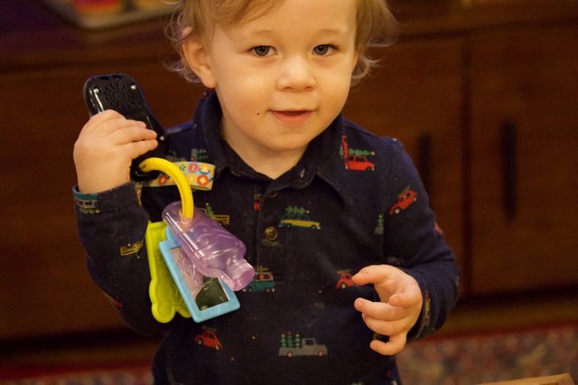 Toddler Playing with Toy Keys at Christmas
