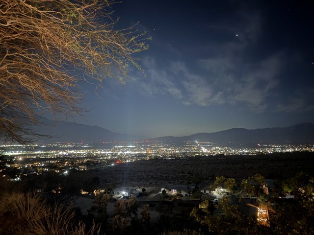 Starlit Metropolis: Desert Hot Springs at Night