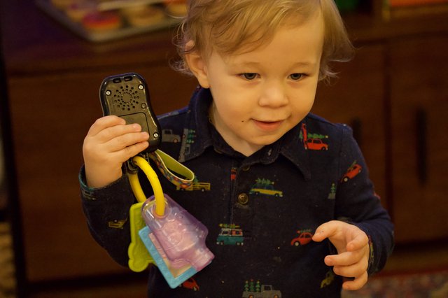Toddler Playing with Toy Phone on Christmas