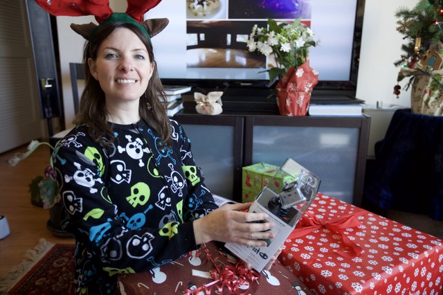 Christmas Morning Gift Unwrapping with Reindeer Antlers