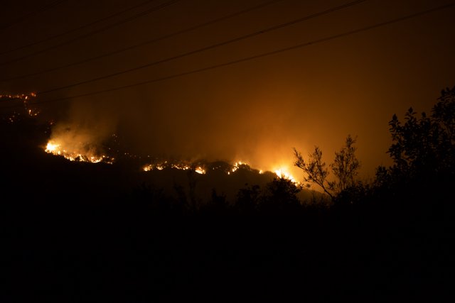 Flames Illuminate Night Sky Amid Station Fire