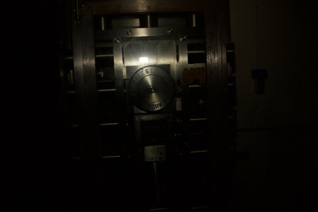 The Clock on the Metal Door