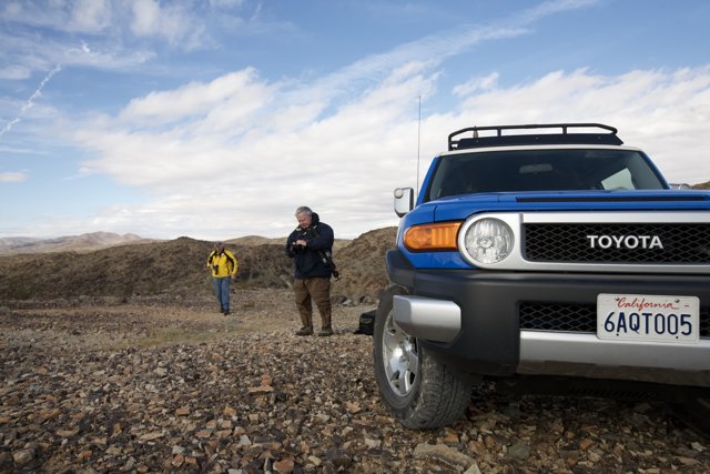 Blue Toyota Truck on a Gravel Road