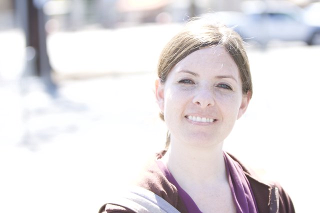 Smiling Woman Outdoors in Bright Natural Light
