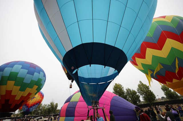 Ground-Level Giants: Hot Air Balloons Ready for Launch