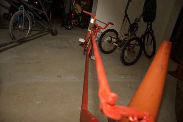 Red Bicycle on Orange Cone