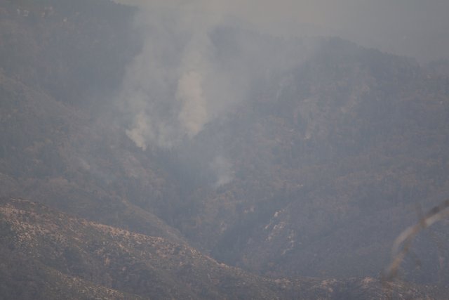 Mountain engulfed in smoke