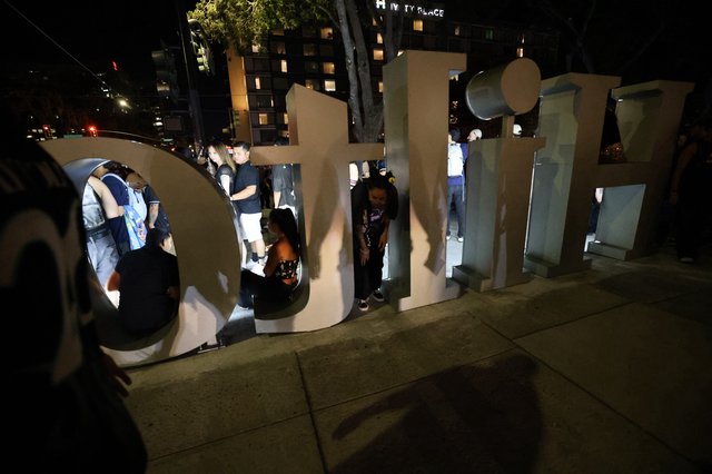 Crowd Gathers Around Giant Letters at Wobbleland Festival