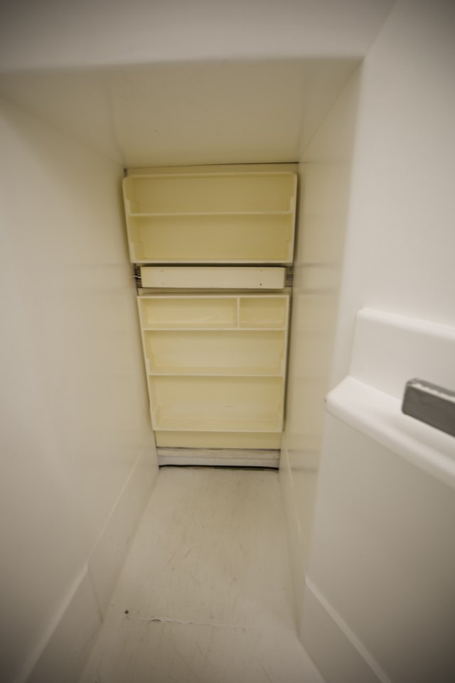 Compact Bathroom Storage Solution in Alcove