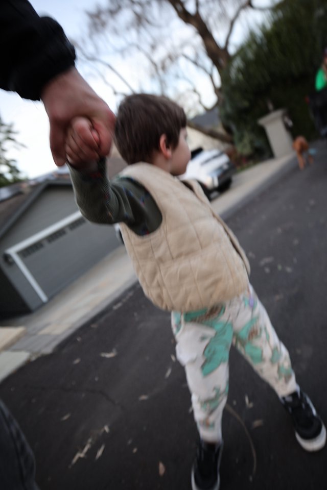 Father and Child Basketball Moment on Suburban Street