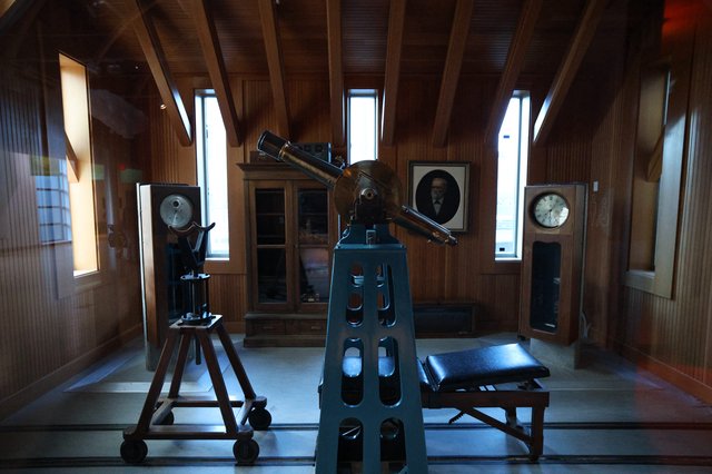 Historic Observatory Interior with Vintage Telescope