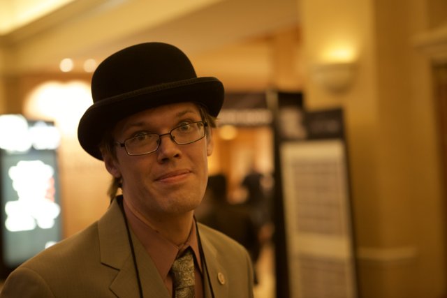 Hank Green Sporting a Stylish Sun Hat and Glasses