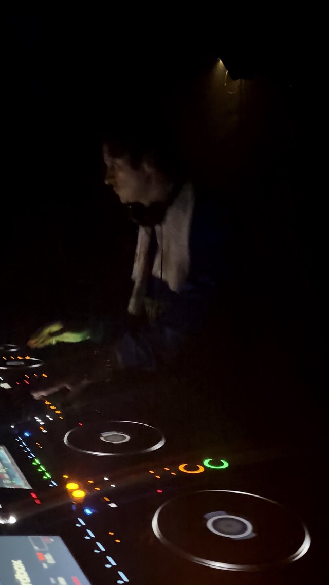 DJ Performance in Darkened London Nightclub