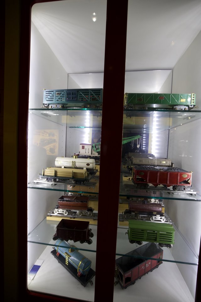 Vintage Model Train Collection Display in Glass Cabinet