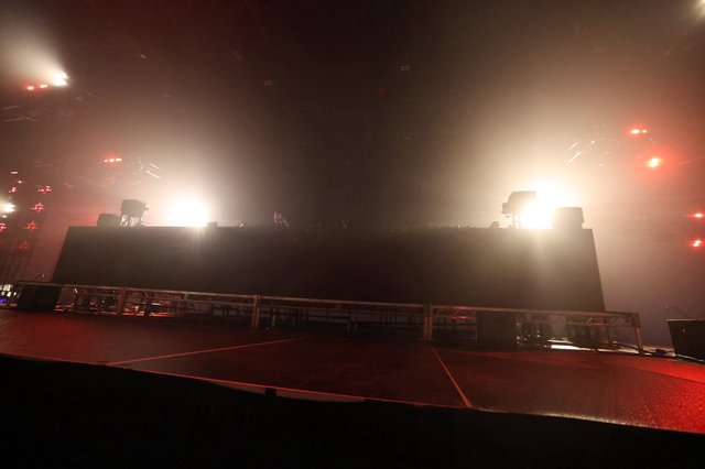 Massive DJ Stage Bathed in Hazy Concert Lights