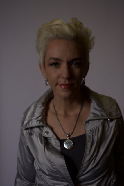 Fashionable Woman with a Necklace and Jacket