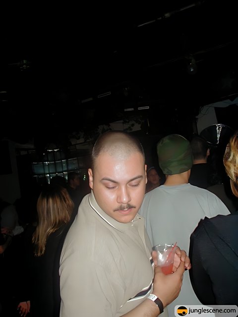Shaved Head and Mustache Man at the Nightclub