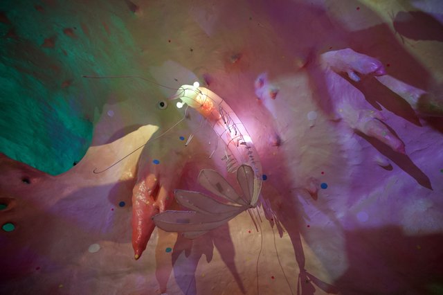 Ethereal Double Exposure with Glowing Insect and Hands