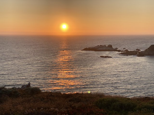 A Panoramic View of a Golden Sunset over the Pacific Ocean