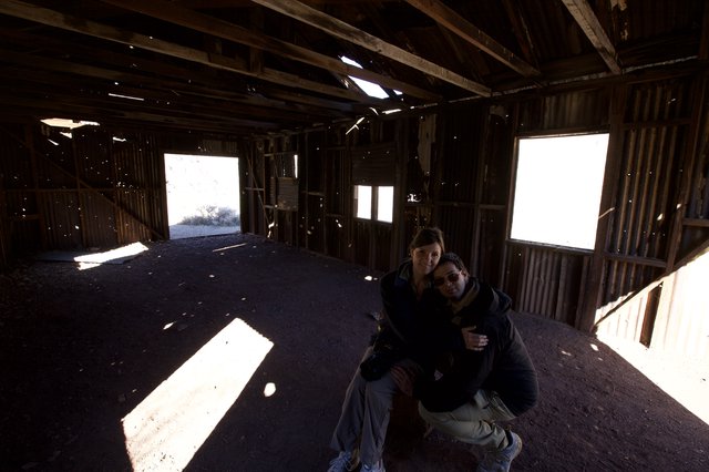 Couple Poses Inside Abandoned Desert Ghost Town Structure