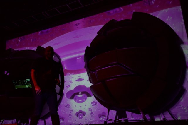 Illuminated Silhouette: A Man and His Planetarium