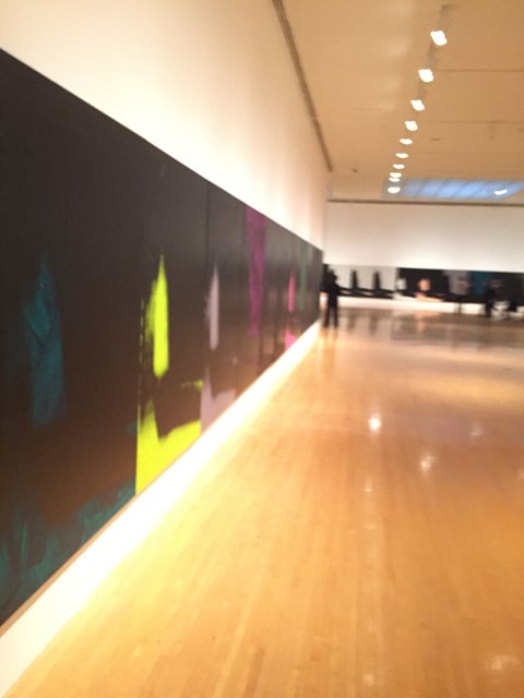 Vibrant Art Adorns Sleek Black Wall