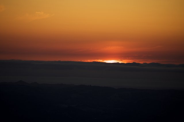 Last Light Burns Beyond Distant Mountain Ridges