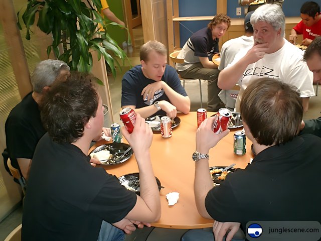 Group of Men Enjoying a Lunchtime Meal