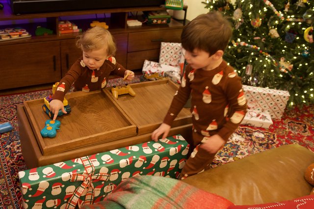 Brothers Opening Christmas Gifts on Christmas Morning