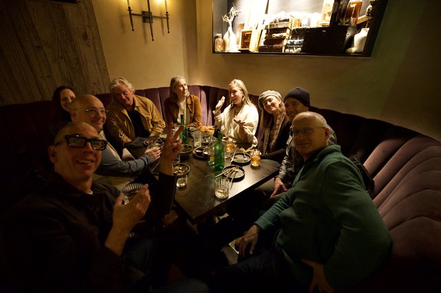 Friends Gathering at Intimate Restaurant Booth