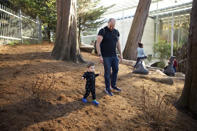 Memorable Stroll: A Man and a Child in Nature's Embrace