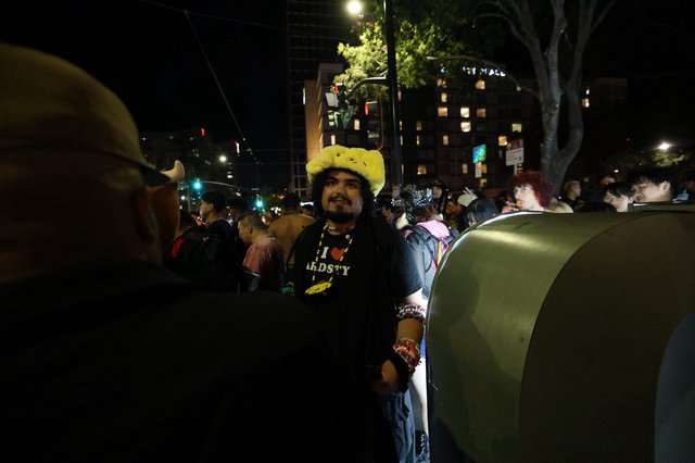 Festival Reveler in Pikachu Hat at Night Celebration
