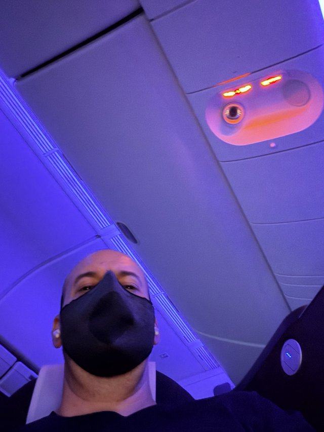 Selfie in Modern Aircraft Cabin with Ambient Purple Lighting